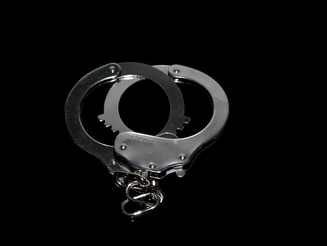 handcuffs on black background