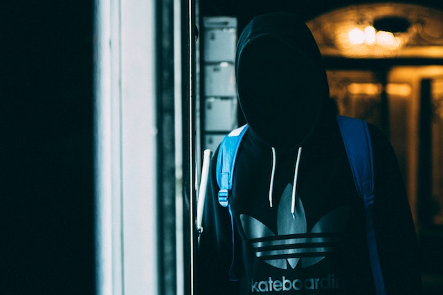 teen with face obscured wearing hoodie