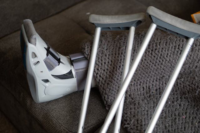 person with crutches and boot