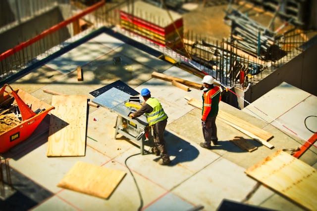 men in hard hats on job site