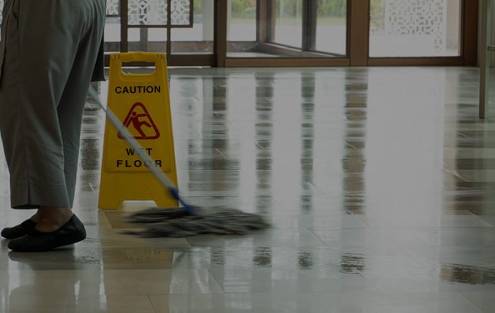 person mopping a floor
