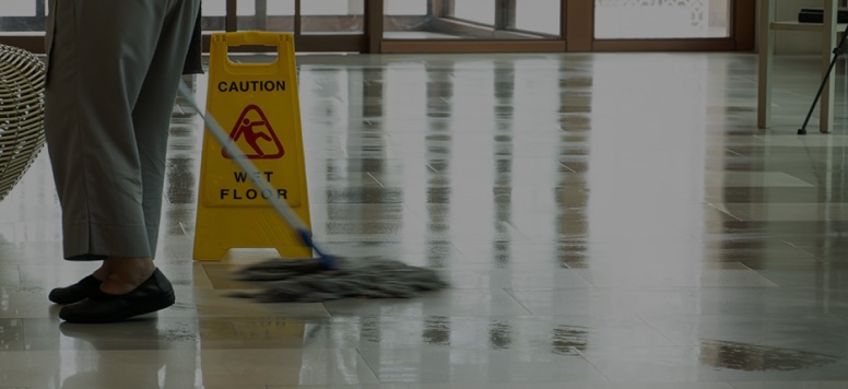 person mopping a floor