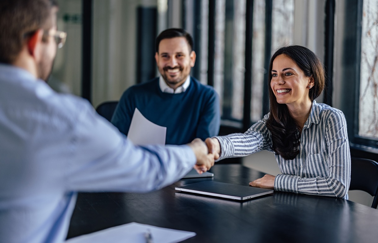 lawyer shaking hands with clients