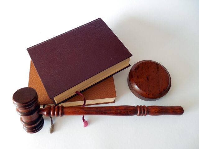 gavel next to stack of books
