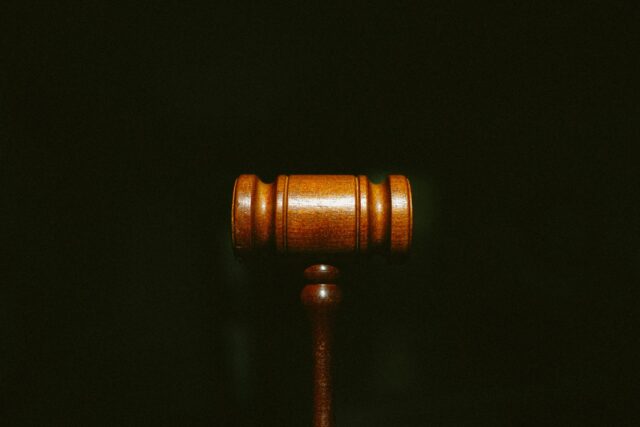 brown gavel against black background